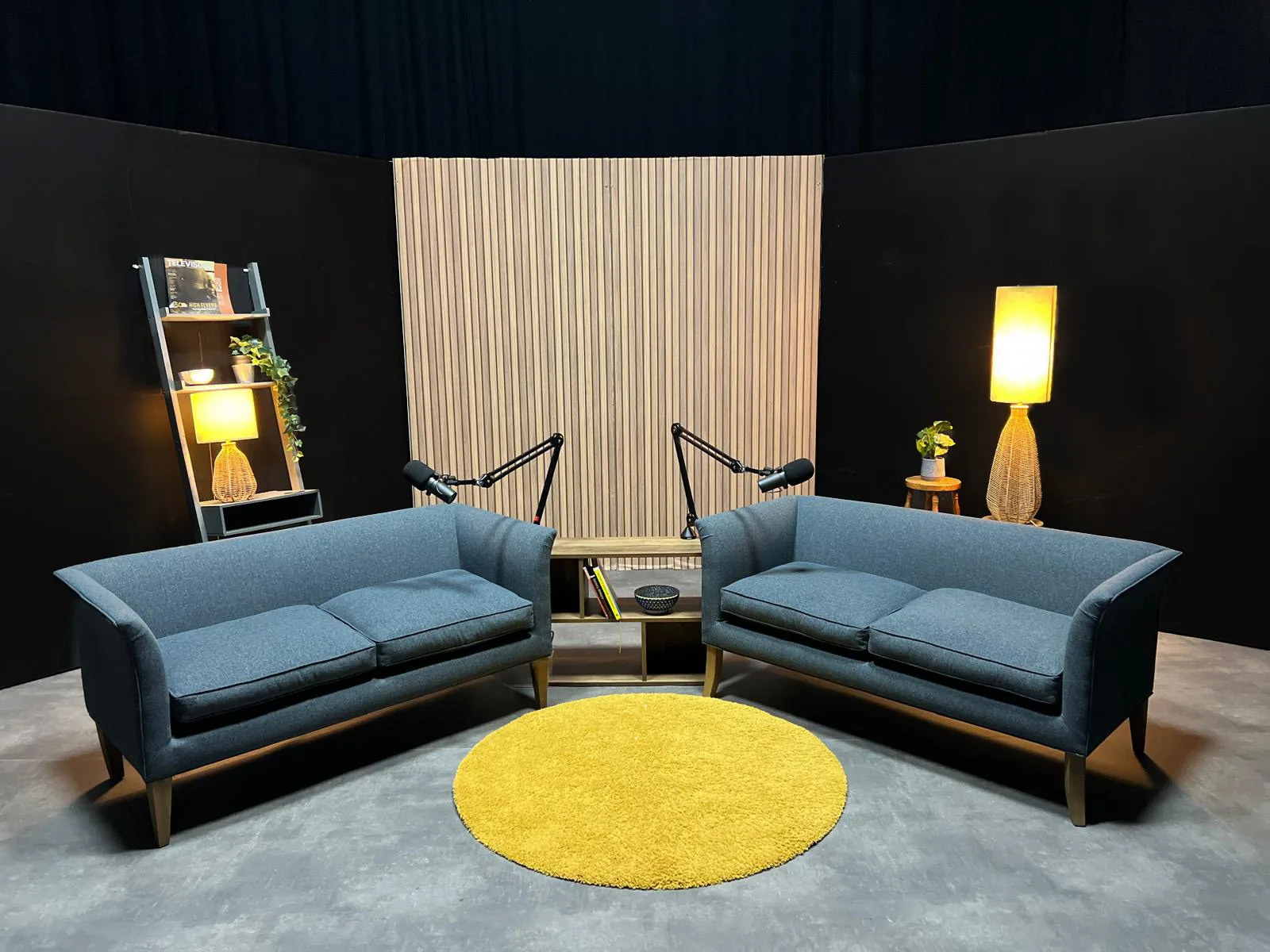 The Studio Barn Chippenham podcast set with sofas, boom microphones and acoustic backdrop